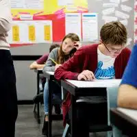 Students doing the exam in classroom